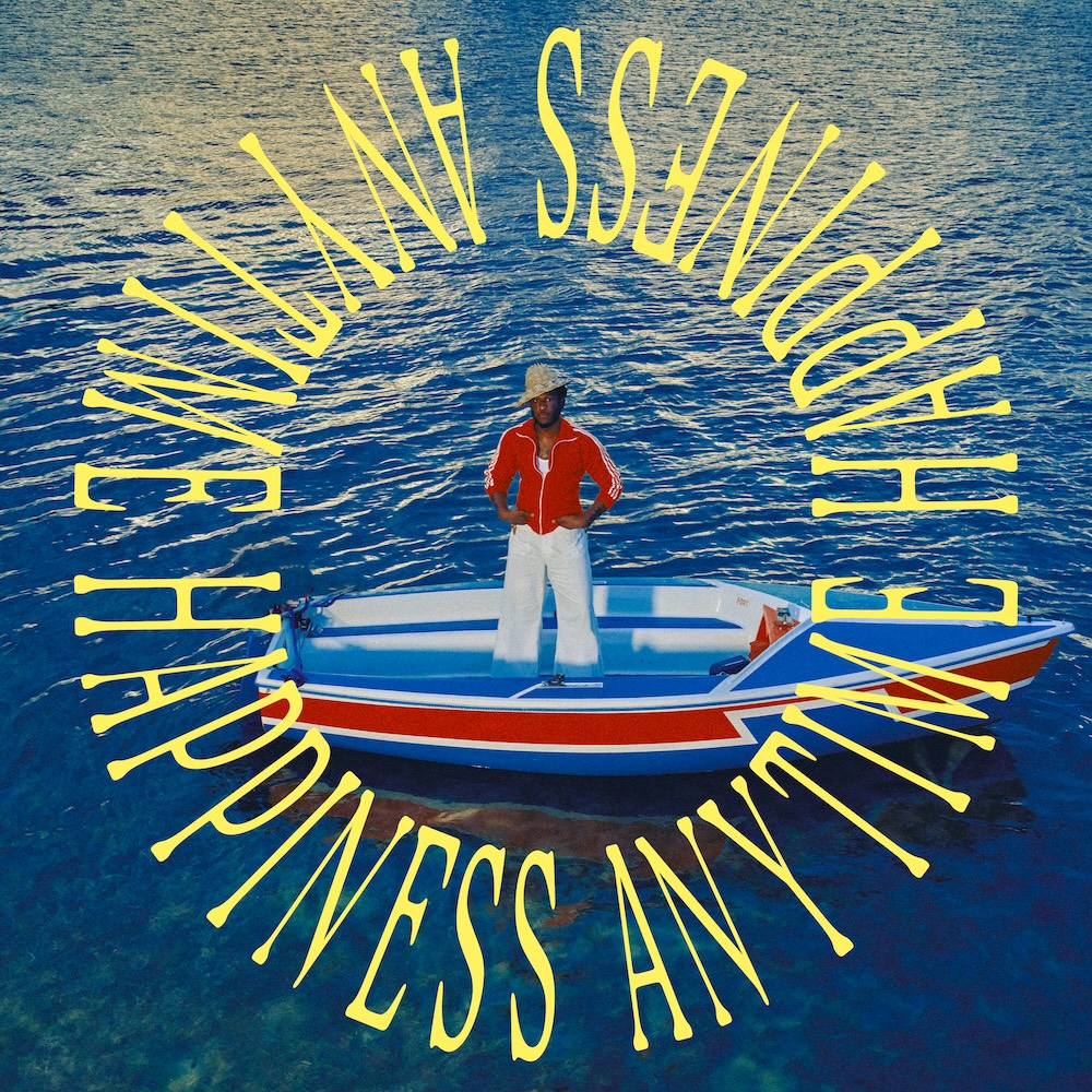 Leon Bridges standing on a boat in deep blue water on the album artwork for Happiness Anytime, framed by yellow circular text.